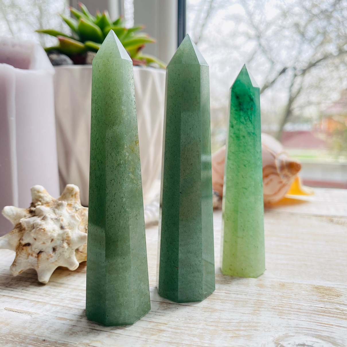 Green crystals standing on white table